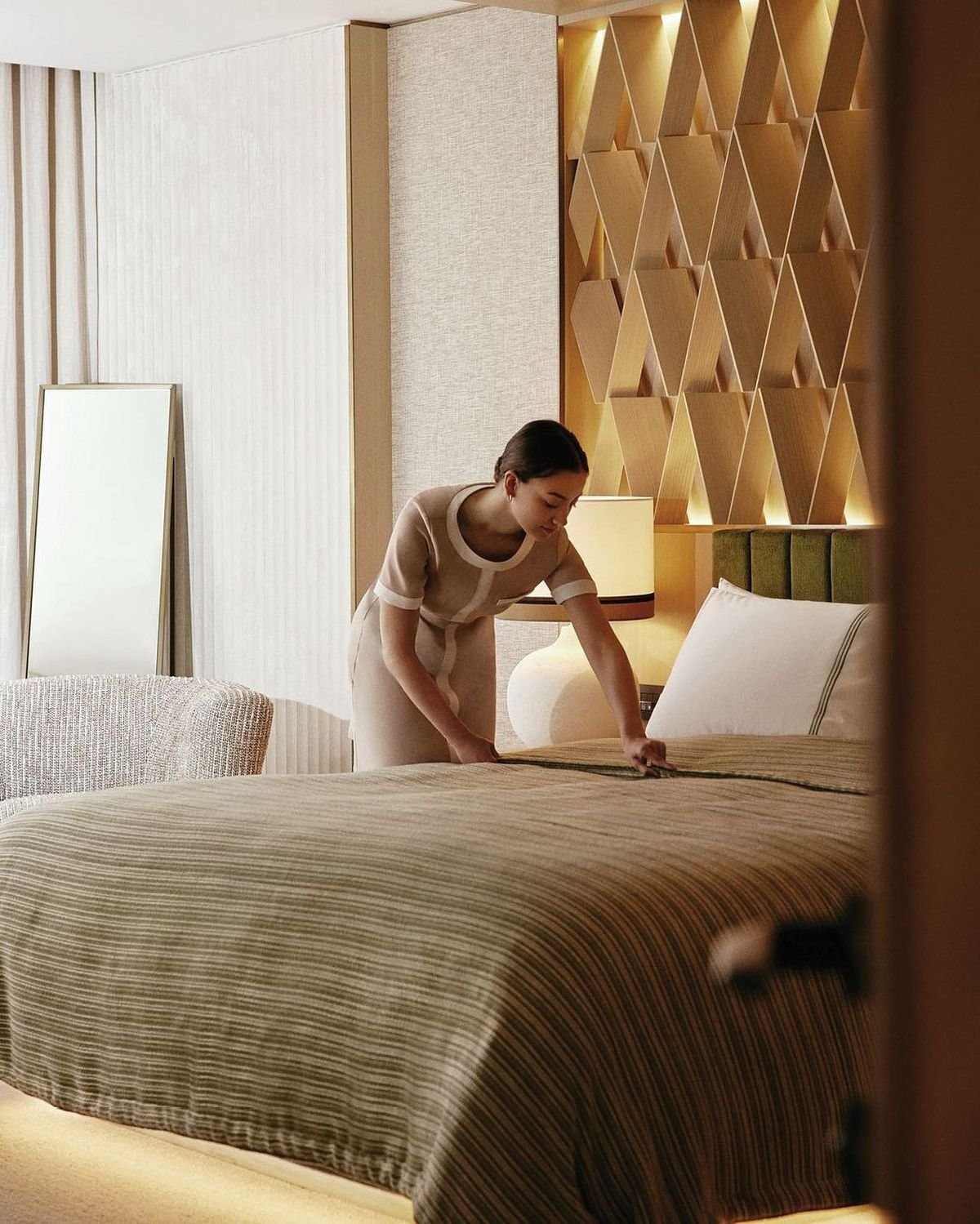 Ikor housekeeping team member preparing a guest room